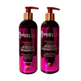 Mielle Organics Pomegranate & Honey shampoo-bouteille démêle les cheveux et laisse de la douceur.