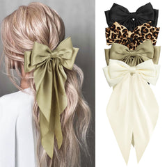 Noeud cheveux satin noir Mikoniko, élégant et doux pour tous types de cheveux.