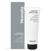 Masque Minimalist, bouteille du soin capillaire, répare les cheveux endommagés en profondeur.