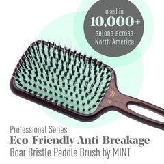 Brosse Mint paddle poils sanglier et nylon nourrissent les cheveux sans tiraillement.