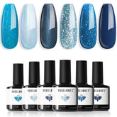 Modelones vernis gel bleu scintillant avec effet galaxie et œil-de-chat pour ongles éclatants.