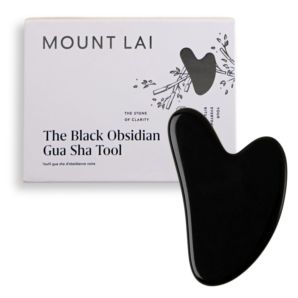 Mount Lai gua sha visage en obsidienne noire, favorise drainage lymphatique et clarté cutanée.