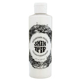 Mountain Ocean Skin Trip Lotion pour le corps coco, bouteille élégante prête pour hydratation rapide.