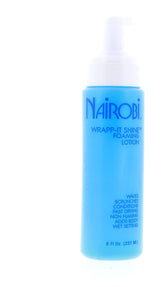 Nairobi Wrapp-It Shine foaming lotion bottle on bathroom vanity for daily hydration.