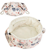 Trousse Narwey Baril grande avec motif floral beige et flamant rose, idéale pour le voyage.