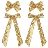 NCMAMA clip-cheveux noeud-or étincelant, idéal pour occasions festives.