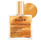 Nuxe Huile Prodigieuse Shimmer — bouteille lumineuse pour éclat naturel sur peau et cheveux.