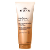 Nuxe Prodigieux gel douche vegan dans sa bouteille dorée, hydratant et parfumé pour la peau.