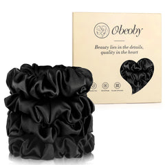 Chouchou obeoby en soie de mûrier noir, gros plan, douceur pour cheveux délicats.