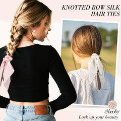 Obeoby noeud satin rose pastel, douceur pour cheveux delicats et style discret.