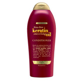 OGX Frizz-Free + Keratin Smoothing Oil Conditioner bottle pour demonstrates frizz control and shine