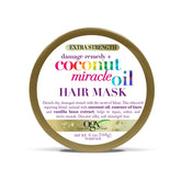OGX Remède anti-dommages masque coco-cheveux épais pour douceur et réparation.