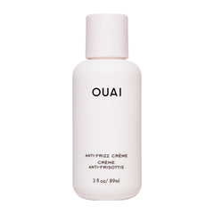 OUAI Crème Anti-Frizz Voyage: bouteille compacte pour cheveux lisses et sans frisottis.