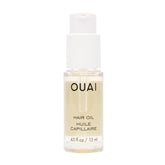 OUAI Huile Cheveux voyage: bouteille compacte prête pour la protection de la couleur lors des déplacements.