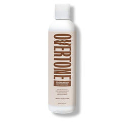 Cette image montre la texture crème de oVertone prête à être appliquée sur les cheveux.