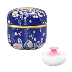 Qopoto pouf-poudre-corps bleu foncé offre une application douce et homogène.