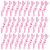 Pinces alligator Rabetly rose à dents larges, pour une tenue fiable lors du coiffage.