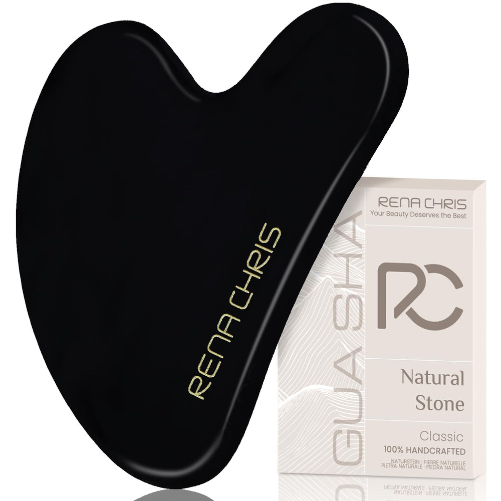 Gua Sha Rena Chris en obsidienne noire sur le visage pour une routine douceur.