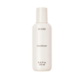 REVERIE après-shampoing nourrissant en flacon, hydratation légère pour tous les cheveux.