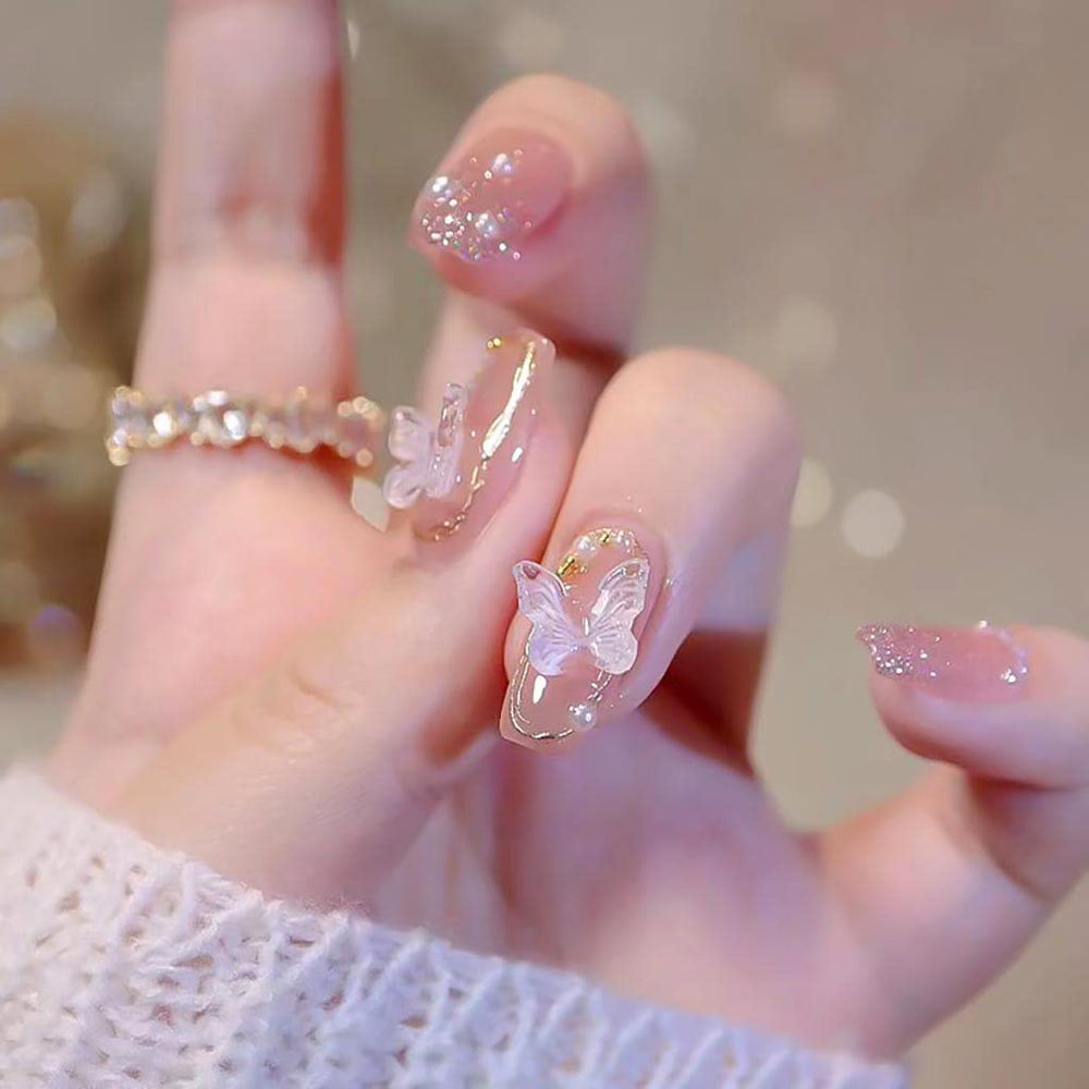 Ongles RikView à poser rose clair avec papillons, brillance durable.