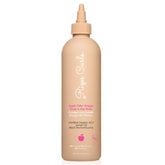 Rizos Curls rinçage cidre versé depuis la bouteille pour clarifier les résidus.