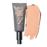 Saie Slip Tint dans sa bouteille en verre pour un teint lumineux.