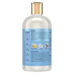 Mousse légère du shampoing SheaMoisture lors du lavage.