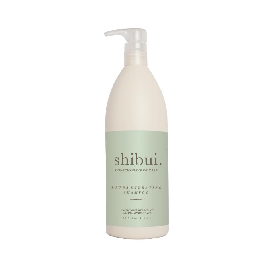 SHIBUI Shampoing Ultra Hydratant bouteille ouverte, hydratation légère pour cheveux texturés.