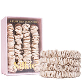 SILKIE scrunchie noir en soie Mulberry pour protéger les cheveux et éviter les noeuds.