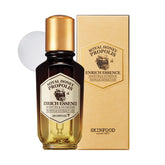 SKINFOOD 1957 Royal Honey Propolis Enrich Essence bottle; hydrating protection for skin.