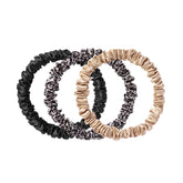 SLIP Skinny Scrunchies noir, tenue douce sans traces pour cheveux délicats.