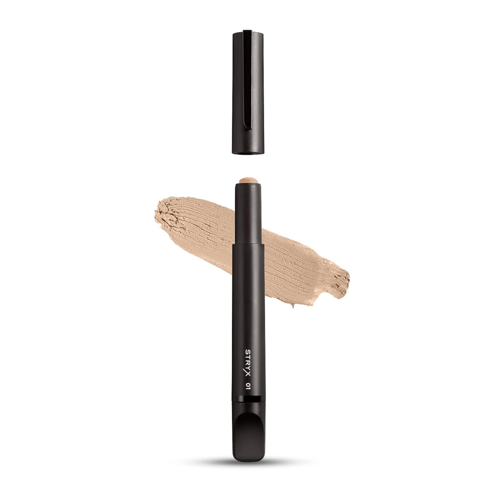 Stryx bâton correcteur dans son étui compact, retouche rapide et discrète.