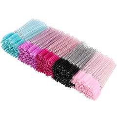 Brosse mascara jetable Tbestmax couleur rose, pour cils nets et soignés.