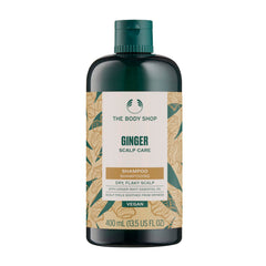 Shampoing Gingembre The Body Shop, bouteille: apaise le cuir chevelu sec et rafraîchit.