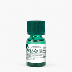 The Body Shop Tea Tree Oil: goutte appliquée localement pour peau grasse et nette.