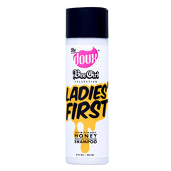 The Doux Shampoing Cheveux Boucles – bouteille lumineuse, hydratation longue pour boucles définies.