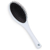 Brosse The Hair Shop à boucle bleu clair, démêlage en douceur et ergonomie.