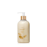 Thymes Goldleaf hand wash bottle pump showing hydrating formula with glycerin and jojoba.