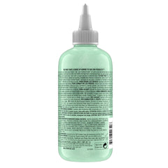 Sérum TIGI Bed Head Control Freak, cheveux lisses et brillants après séchage.