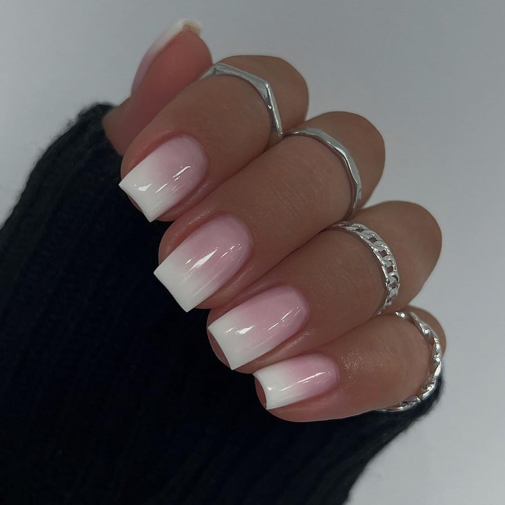 Ongles TOGZOM ombrés carrés moyens rose et blanc, élégants et durables.