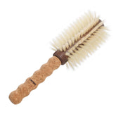 Brosse TRENFI ronde avec barillet et poils de sanglier pour du volume durable.