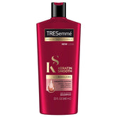 TRESemmé Keratin Smooth Shampoo bottle shows frizz control and smooth movement.