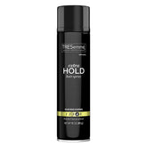 Spray coiffant TRESemmé Niveau Quatre en flacon, tenue longue durée.