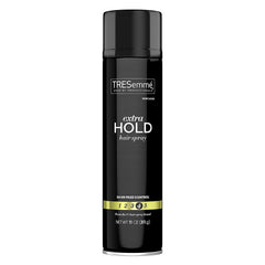 Spray coiffant TRESemmé Niveau Quatre en flacon, tenue longue durée.