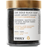 Truly Savon Noir 24K Or Beurre Luxe sur flacon élégant, prêt pour votre routine.