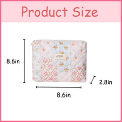 Pochette coquette florale signée uekeboag, idéale pour transporter vos cosmétiques en voyage.