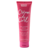 Umberto Giannini Creme De Curl – bouteille élégante pour contrôle des boucles et définition durable.