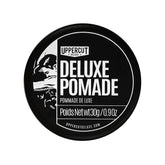 Pomade Uppercut Deluxe en bouteille avec tenue forte et brillance naturelle.