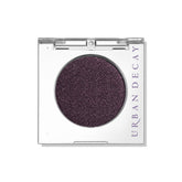 Urban Decay 24/7 Ride: ombre brun profond avec reflets violets pour un regard captivant.
