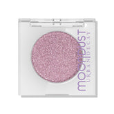 Urban Decay Moondust Space Cowboy paillettes lilas sur les paupières pour un éclat durable.